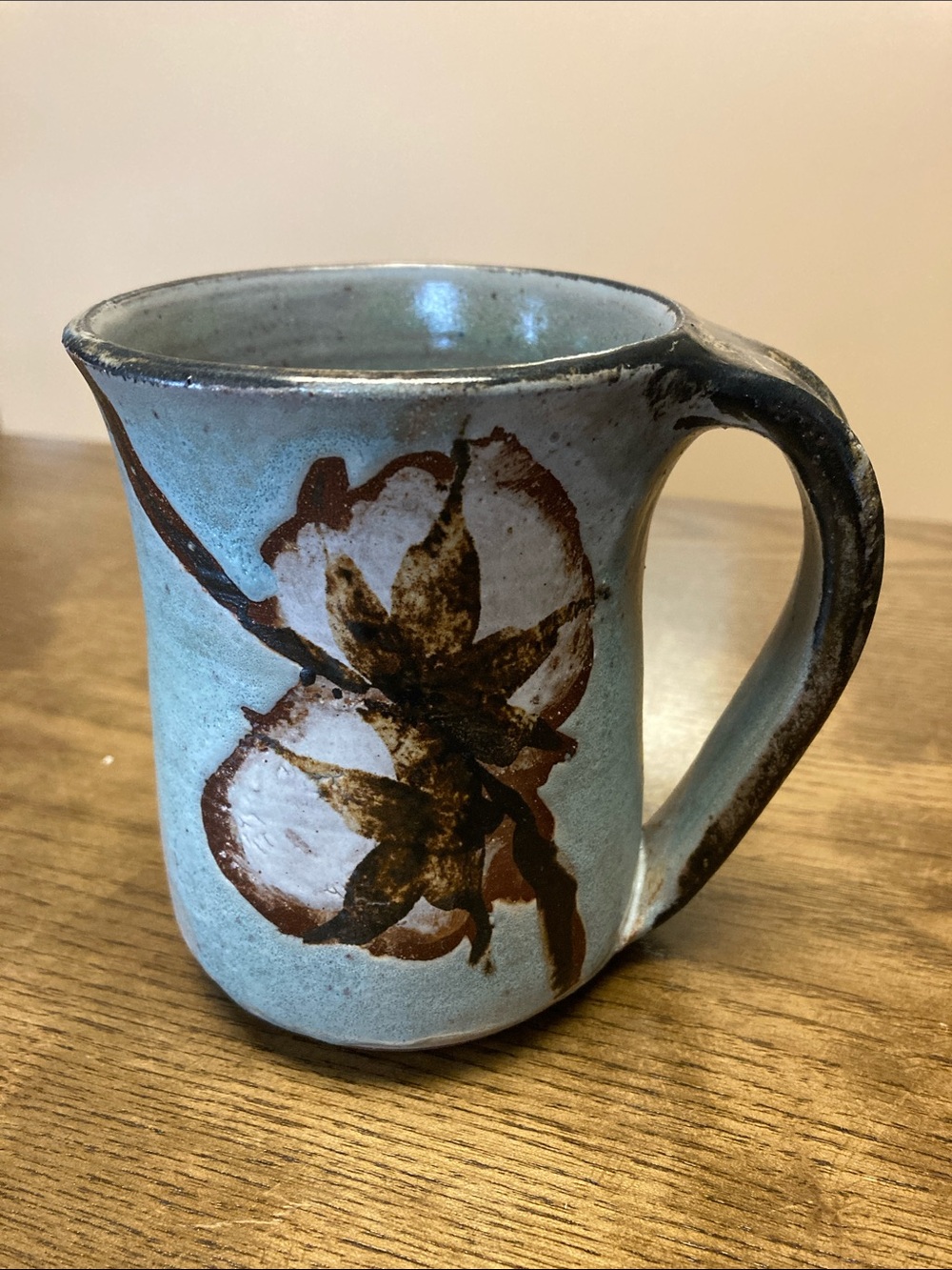 Handcrafted Pottery Mug in Light Blue with Brown Floral Detail